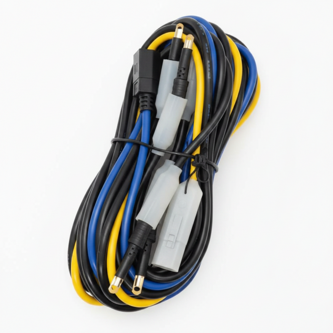 A coiled bundle of multi-colored wires and cables with various connector plugs, including black, blue, and yellow strands, secured with a black tie-wrap on a white background.