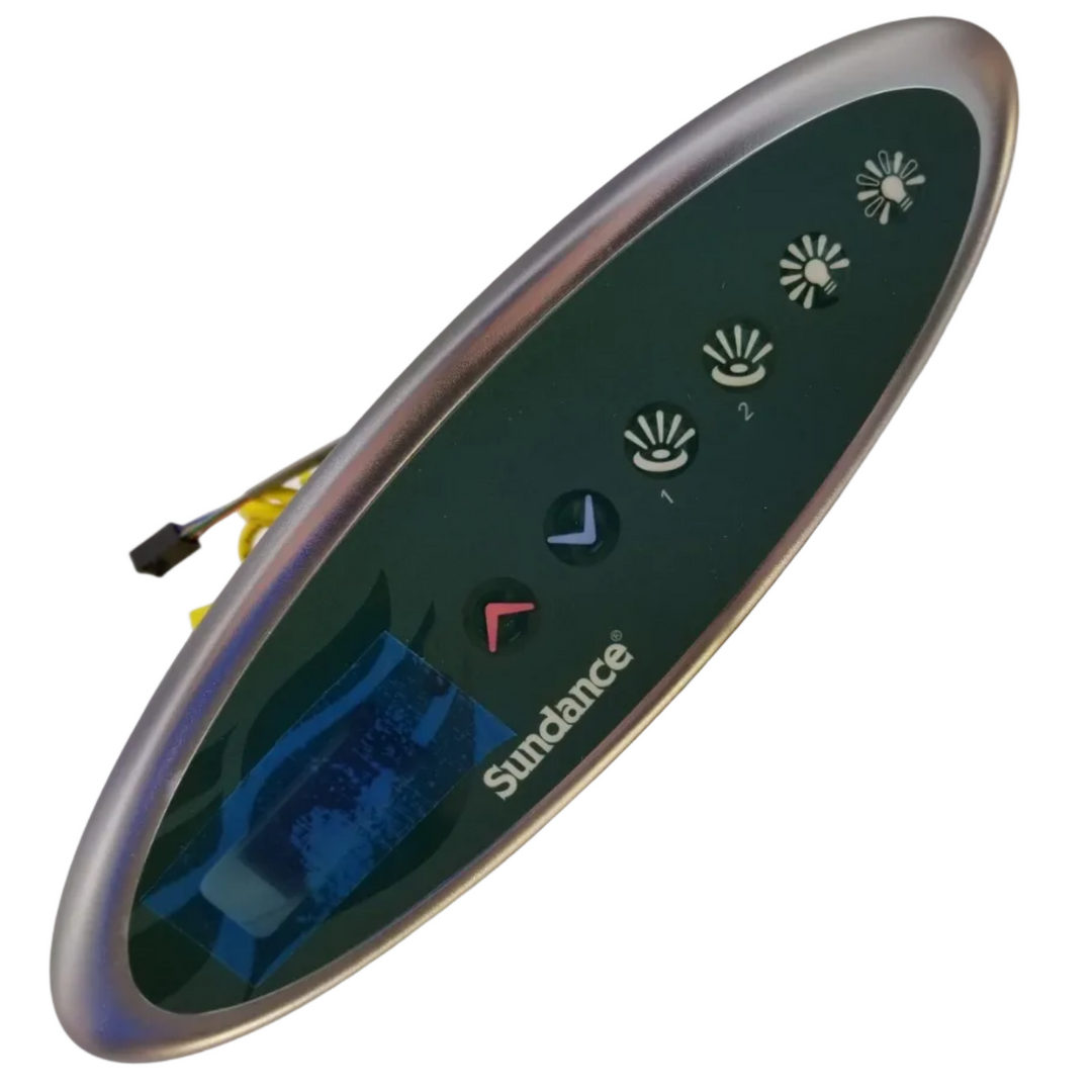 Sundance automatic door opener remote control with a dark green oval faceplate, silver metallic trim, and white button icons, shown on a light background.
